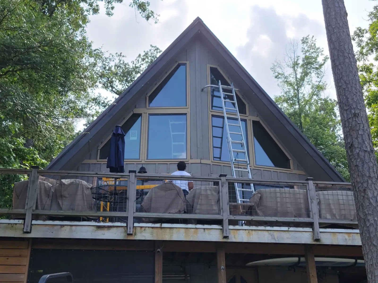 Lakefront A-frame home in The Shores with oversized replacement windows